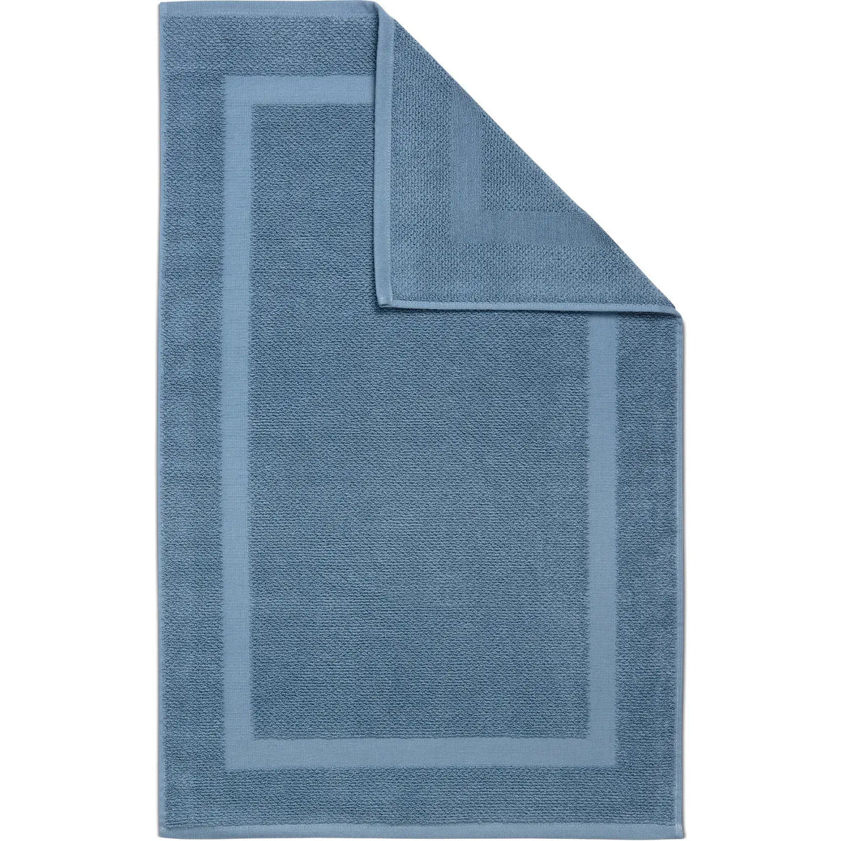 Spa Badvorleger Blau – flach ausgebreitet in Draufsicht mit aufgeschlagener Ecke, sichtbare Vorder- und Rückseite, strukturiertes Frottier mit umlaufendem Rahmendesign in Stahlblau