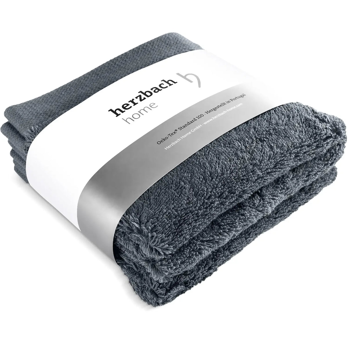 Drei gefaltete blaue Pura Seiftücher mit Herzbach Home Papierbanderole