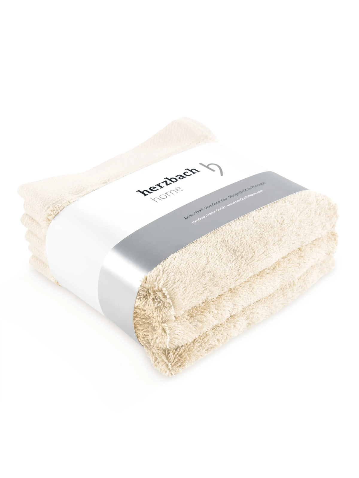 Drei gefaltete mintfarbene Pura Seiftücher mit Herzbach Home Papierbanderole