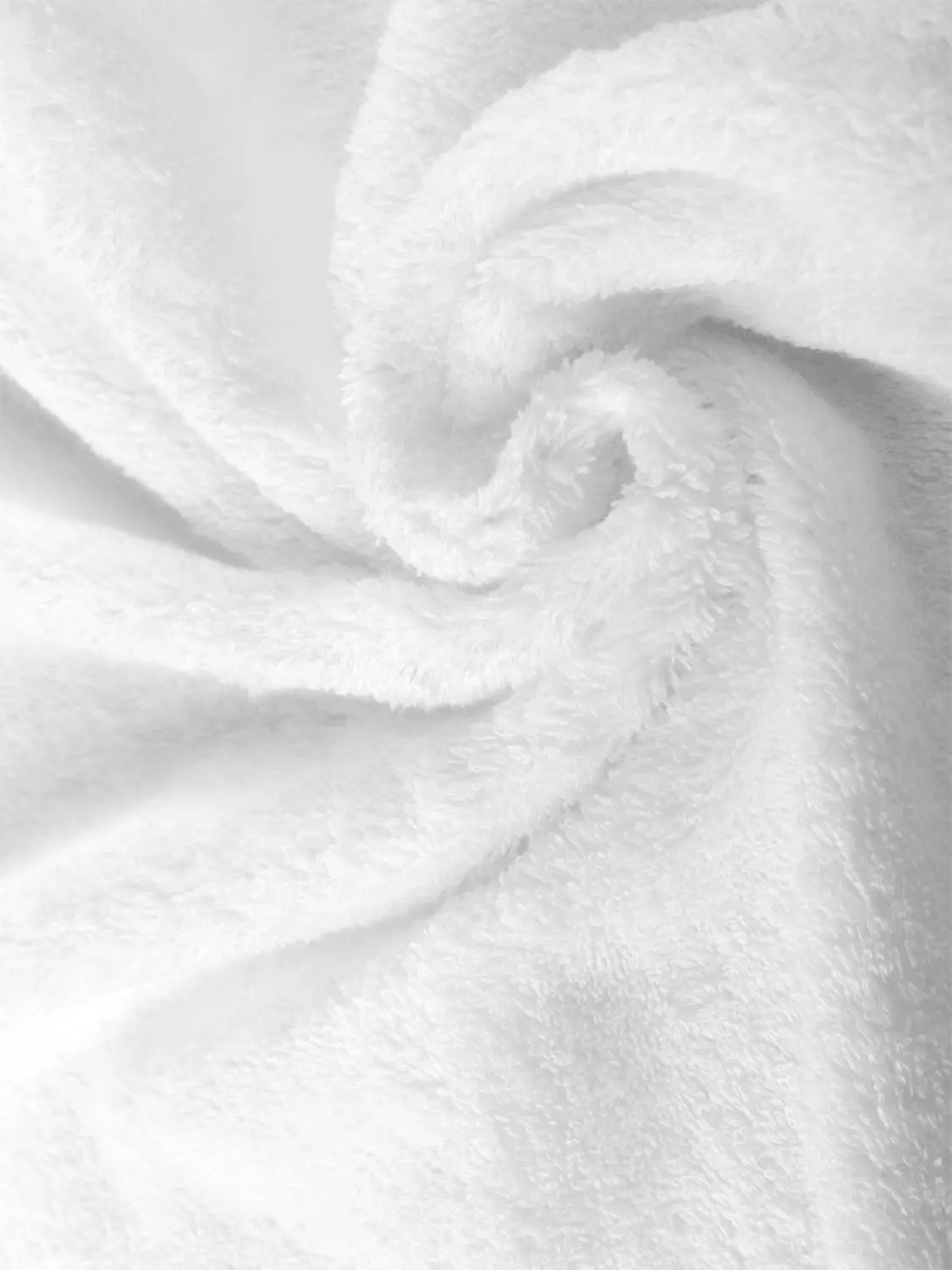 Nahaufnahme von weißem Pura Frottier in spiralförmigen Falten