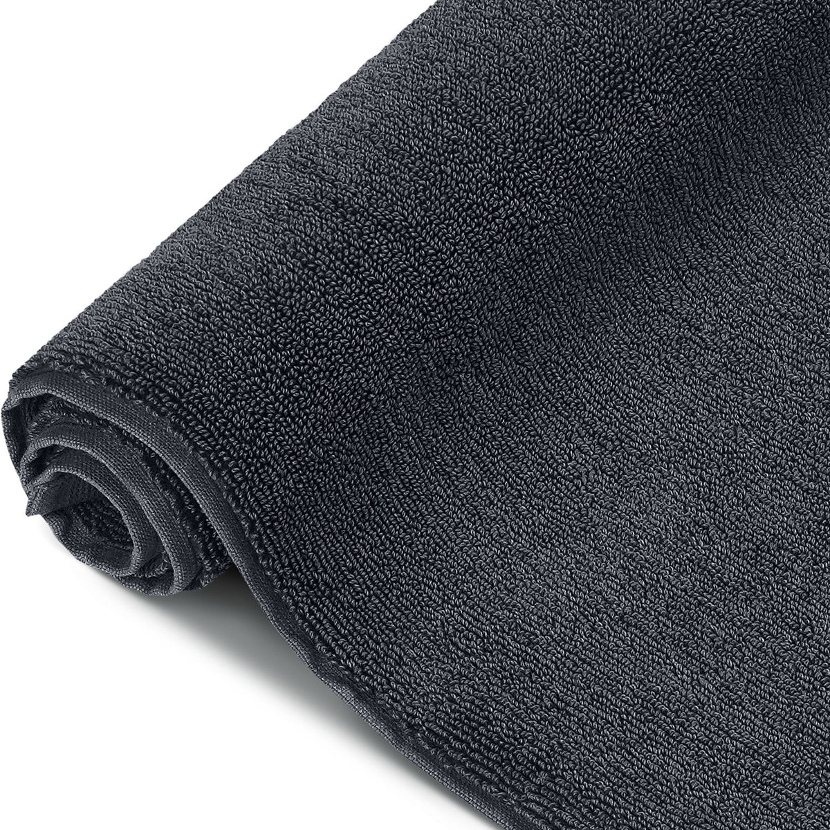 Pura Badvorleger Anthrazit – aufgerollte Seitenansicht in Nahaufnahme, voluminöse und flauschige Frottier-Qualität in sattem Anthrazit, 1200 g/m²