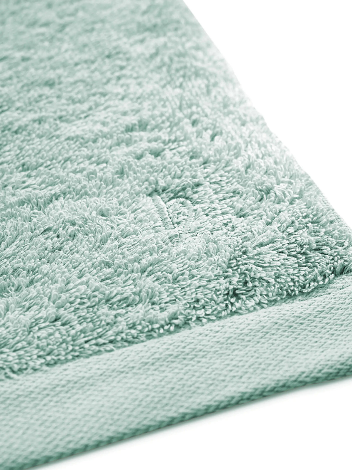 Detail von mintfarbenem Pura Frottier mit glattem Saum
